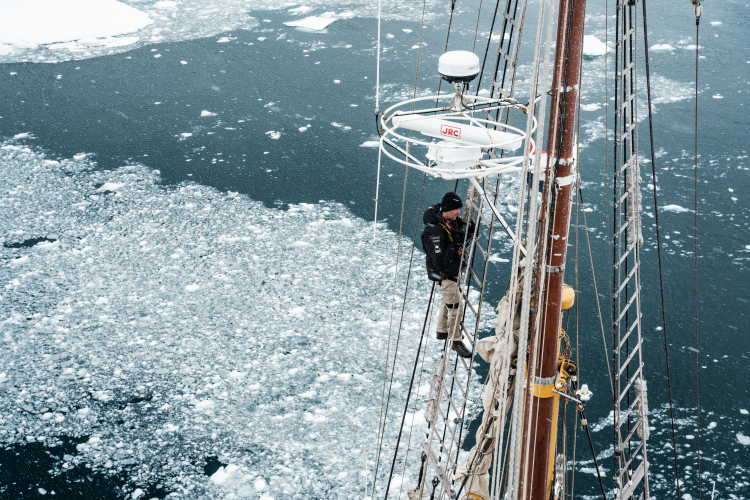 Climbing mast in Antarctica - Bark Europa Benjamin Hardman