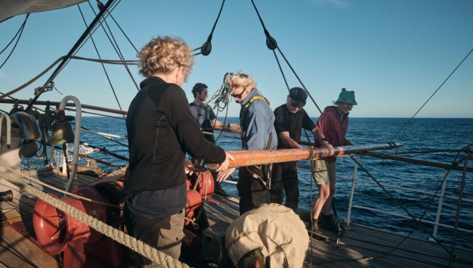 Catching up a fair breeze under full sail over calm seas by Richard Simko
