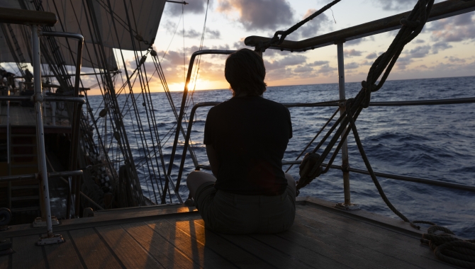 Ocean sailing sunset