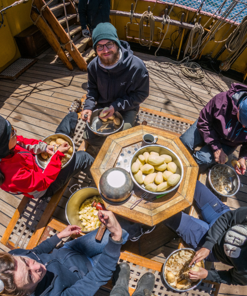 Peeling potatoes on board