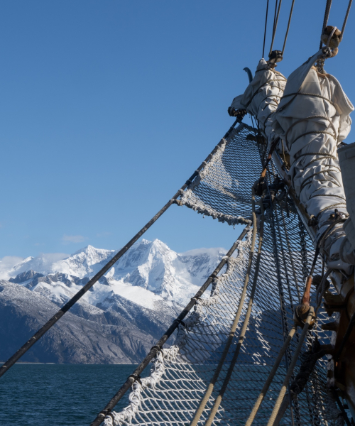 Bark EUROPA's bowsprit with the background of the Chilean Channels
