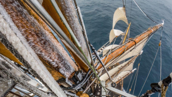 Frost-covered rigging and sails