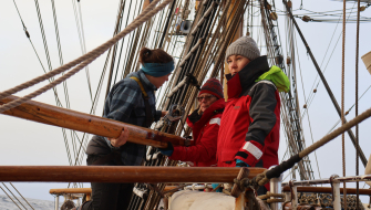 Voyage Crew helping Vera with the starboard whisker pole
