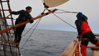 Vera and a voyage crew (Charlie) setting the port whisker pole