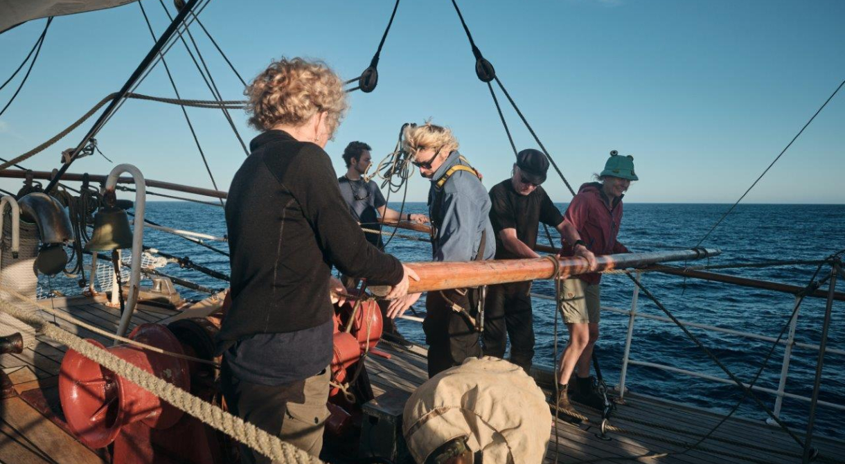 Catching up a fair breeze under full sail over calm seas by Richard Simko