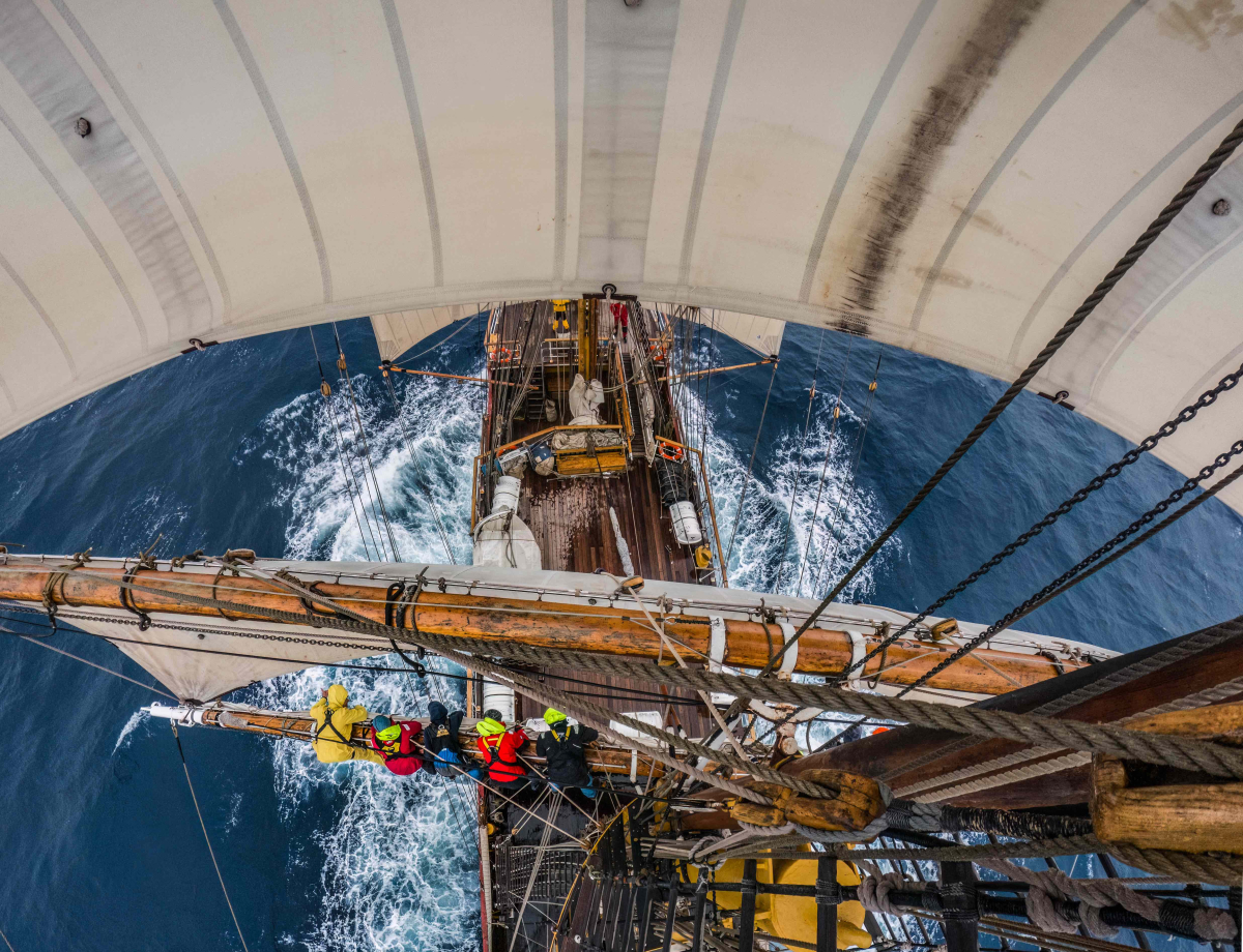 Packing the sails aloft